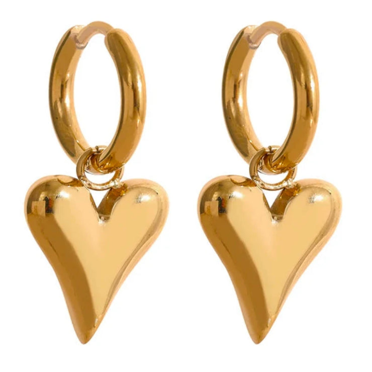 A pair of tiny heart-shaped gold stud earrings